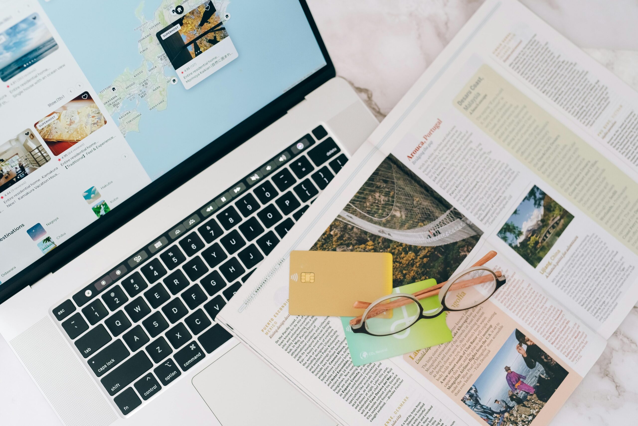 Traveler planning their river cruise itinerary with notebook and laptop