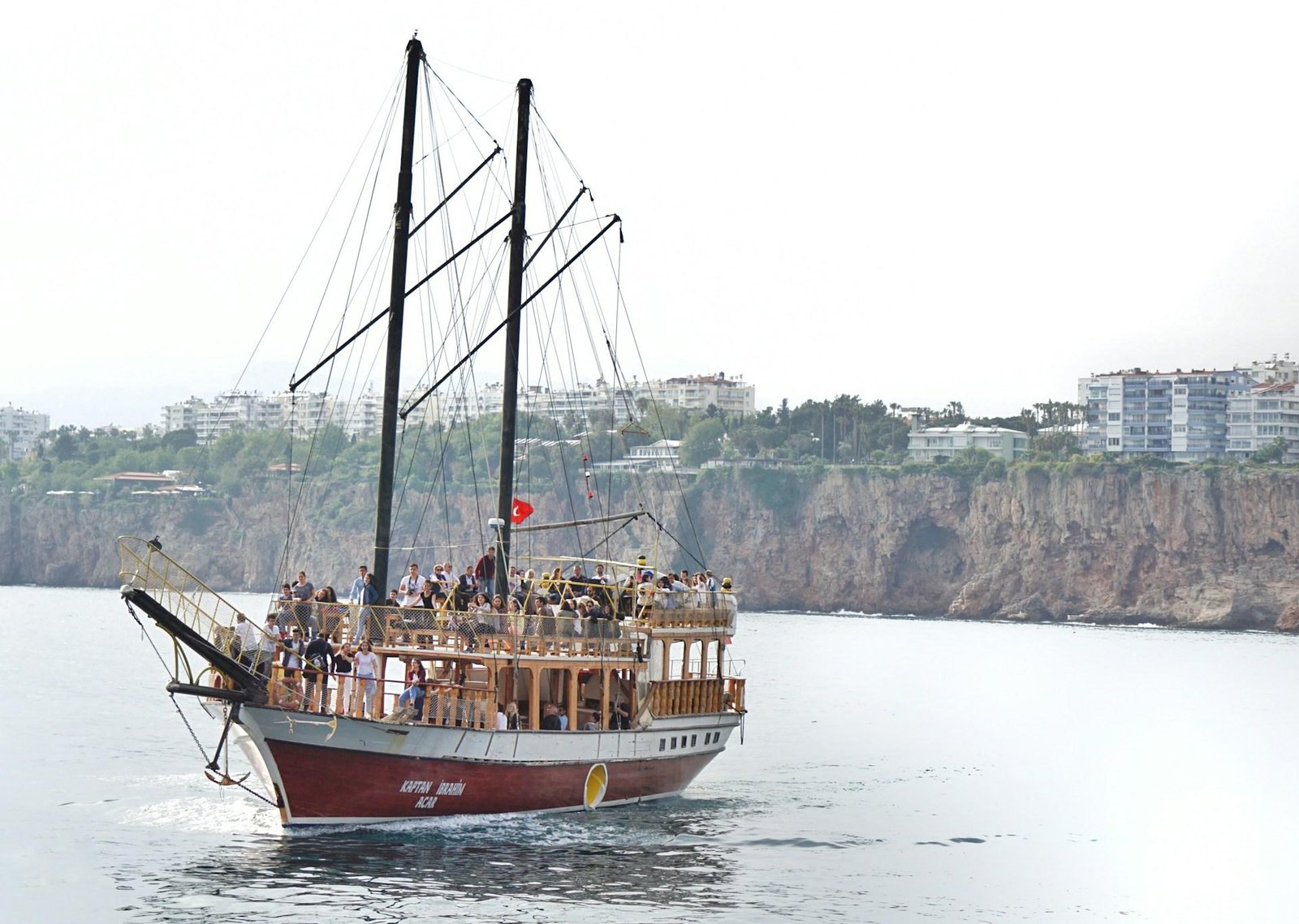 Photo of happy couple holding up new passport copies after theft resolution