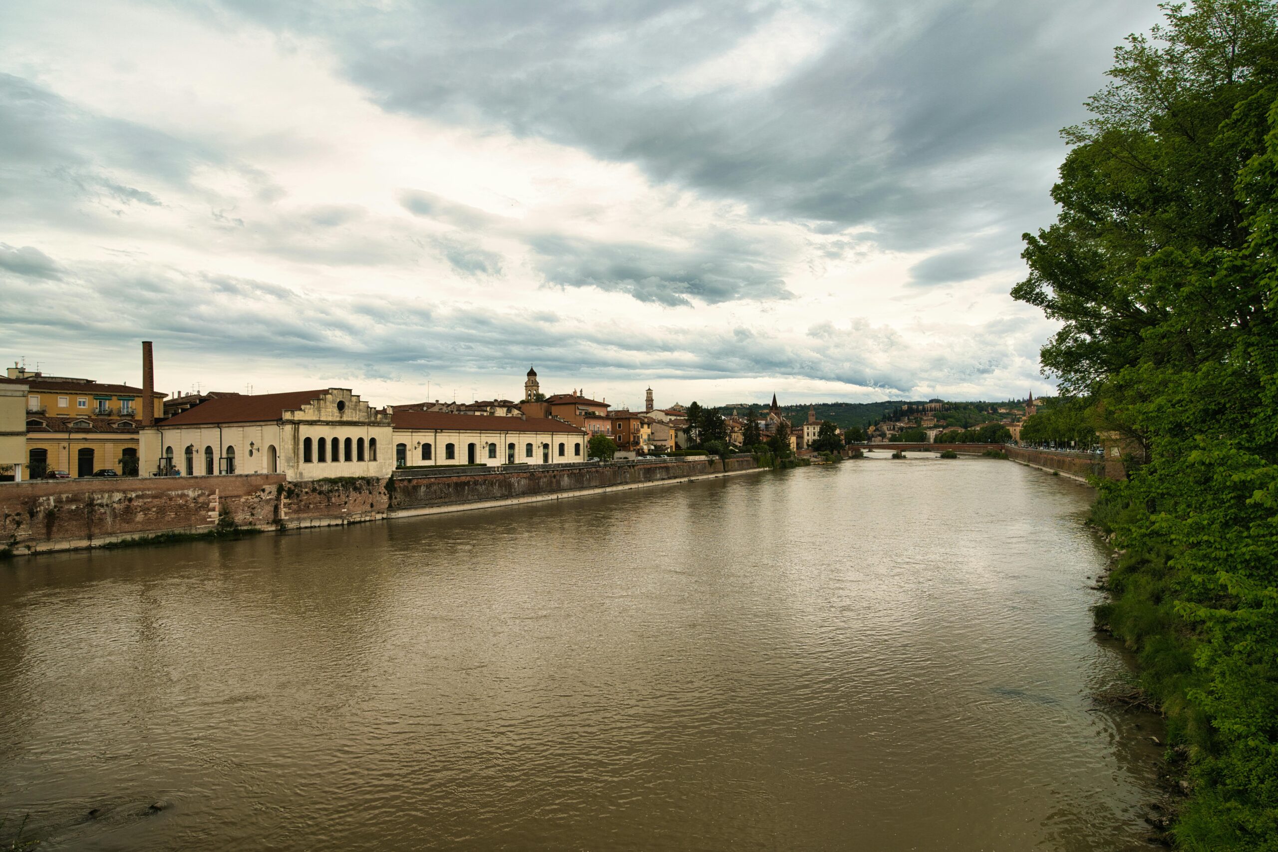 A picturesque view of a scenic waterway tour along a calm European river