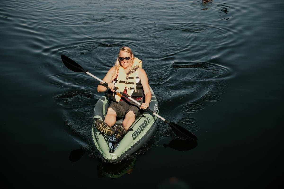 A scenic view of a river with boats cruising peacefully.
