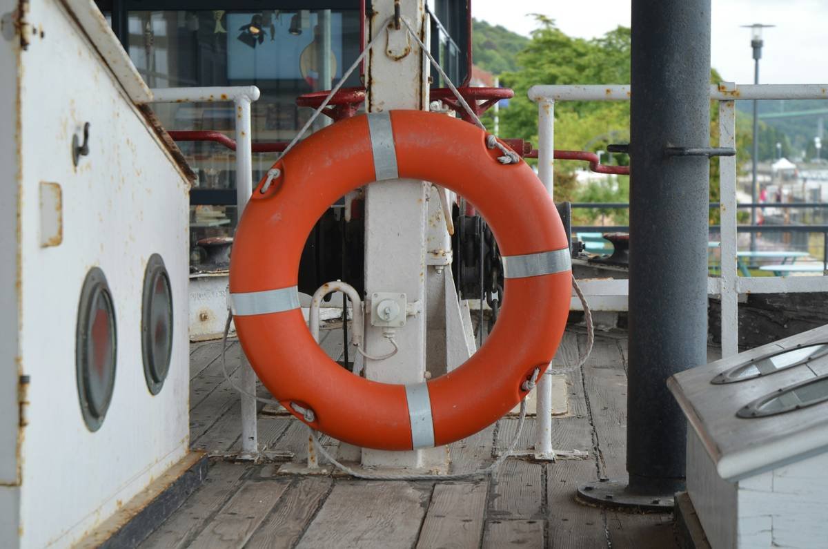 A tourist accidentally tipping over a kayak during a river cruise excursion