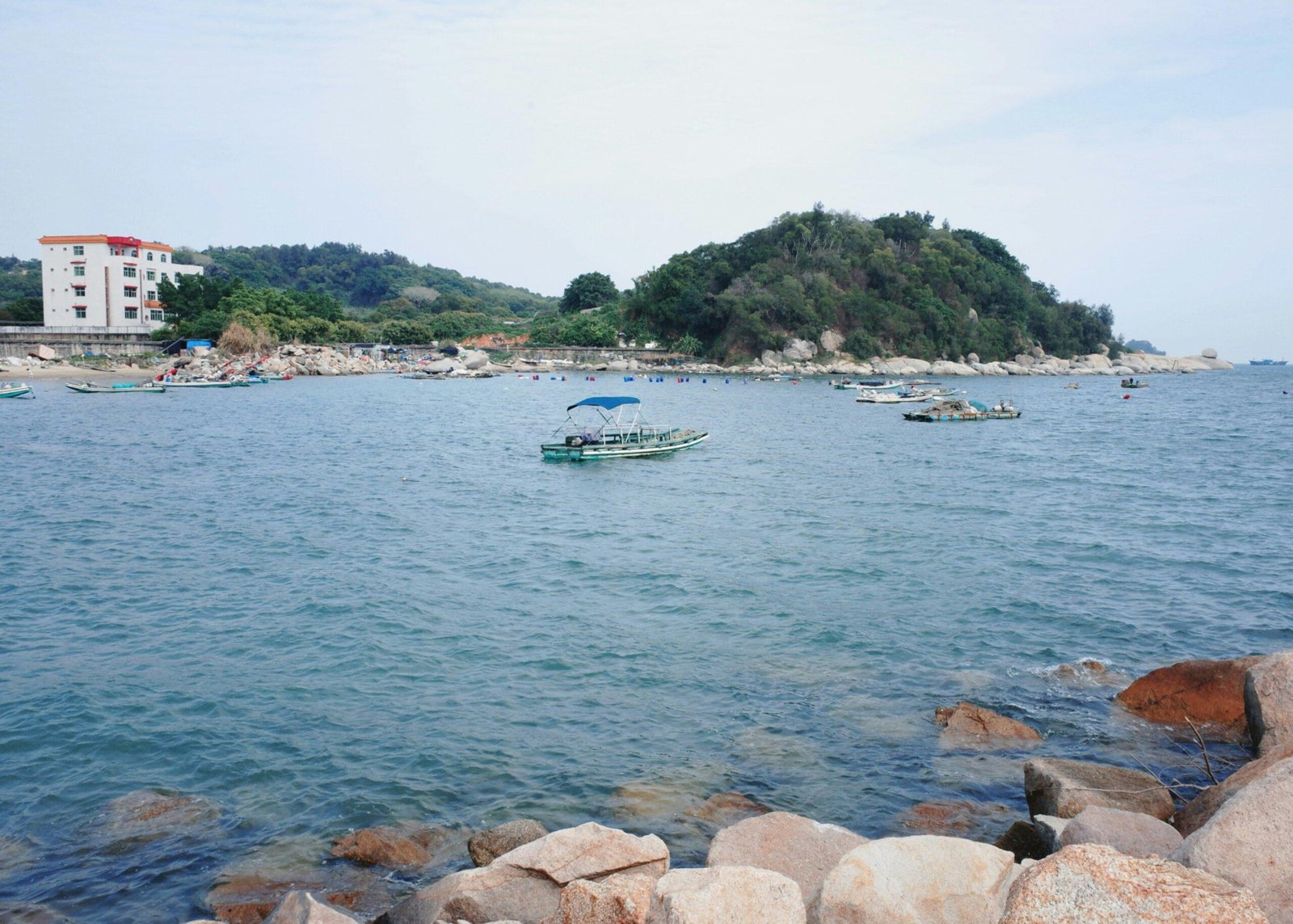 Tourists waiting at a dock due to a delayed shore excursion