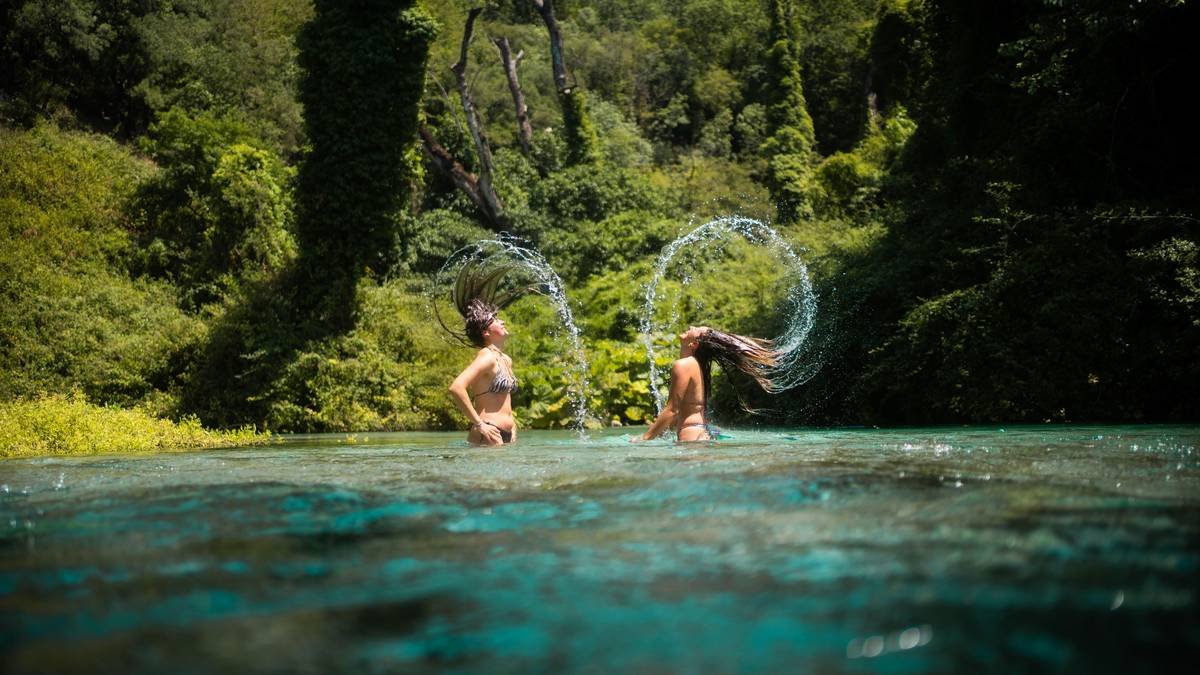 Emergency responders assisting at a riverside location