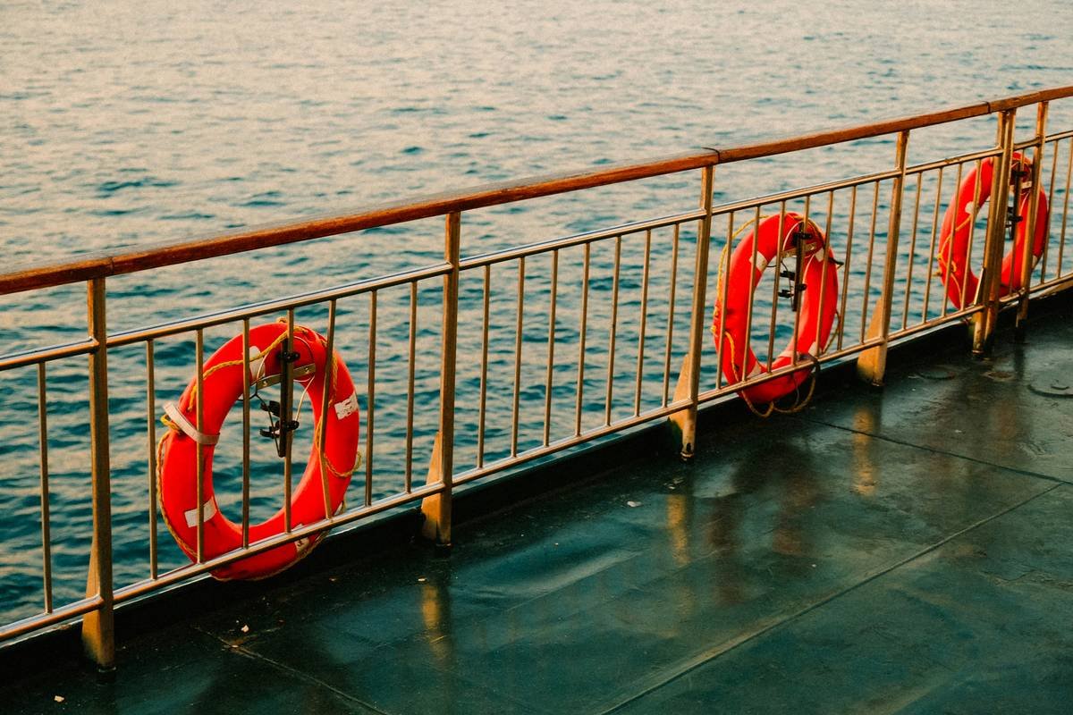 A couple reviewing documents aboard a scenic river cruise