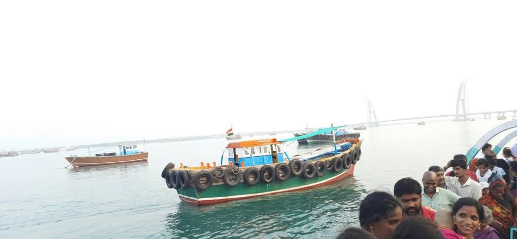 a group of people standing next to a boat in the water