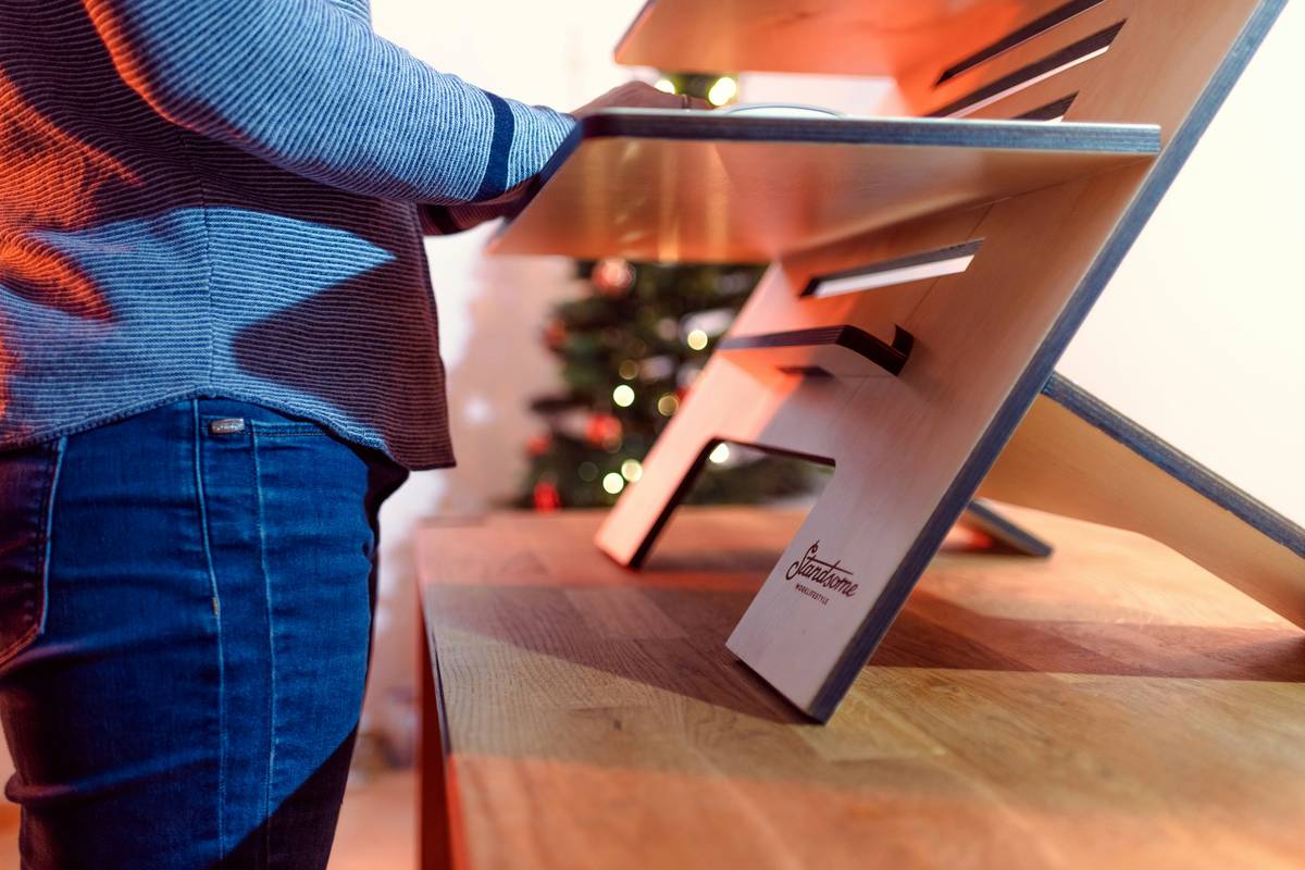 close up of person working at desk topper from home