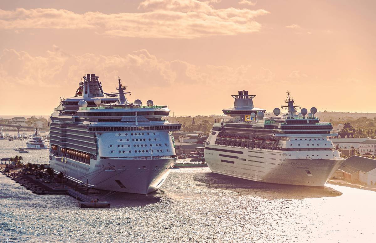 Cruise ships docked at a tropical port in the early morning.