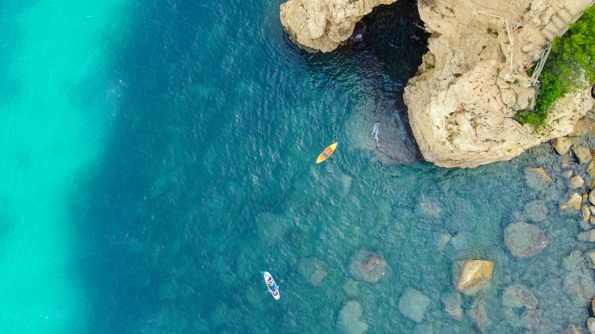 Drone shot of Kajaks at Cova dels Arcs, Spain