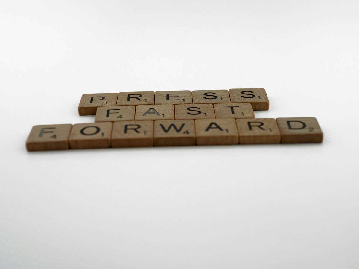 scrabble, scrabble pieces, lettering, letters, wood, scrabble tiles, white background, words, quote, letters, type, typography, design, layout, focus, bokeh, blur, photography, images, image, press fast forward, speed up, let it go, impatient, move on, no time to waste, progress, hurry up, get a move on,