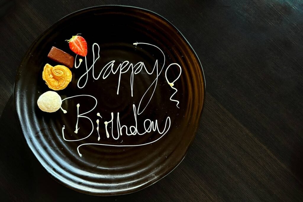 Happy birthday piped in white chocolate.